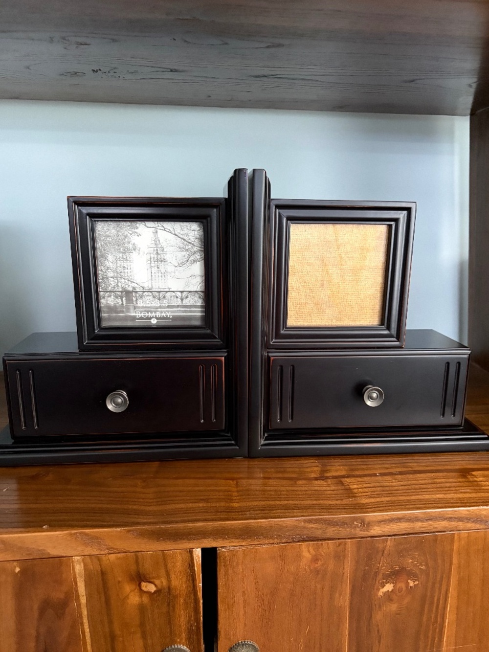 Pair of Bombay wood book-ends with drawers & picture frames, like new.